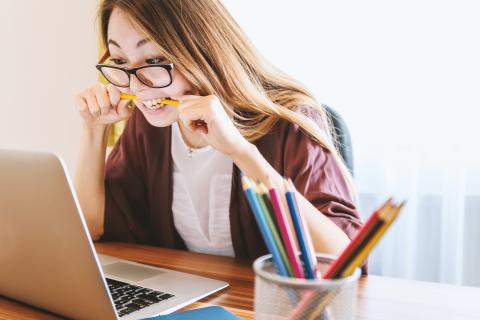 a student biting a pencil in frustration