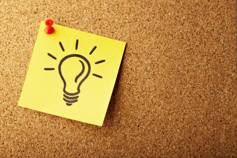 Drawing of a lightbulb pinned to a noticeboard