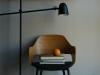 a small stack of books under a reading lamp