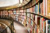 long bookshelves curving in an arc